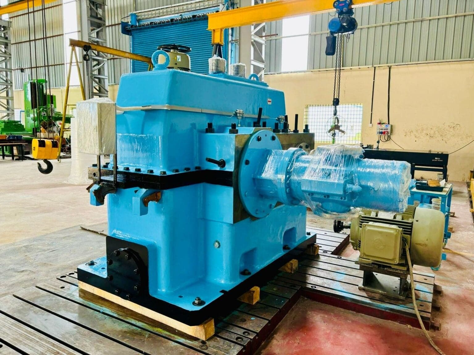 A finished gearbox coupled to its drive motor on the shop floor